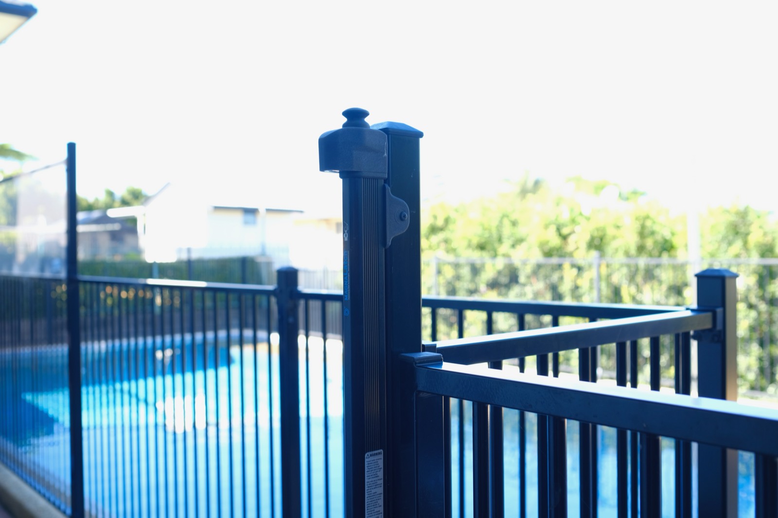 Close-up of pool fence verticals and spacing during an inspection