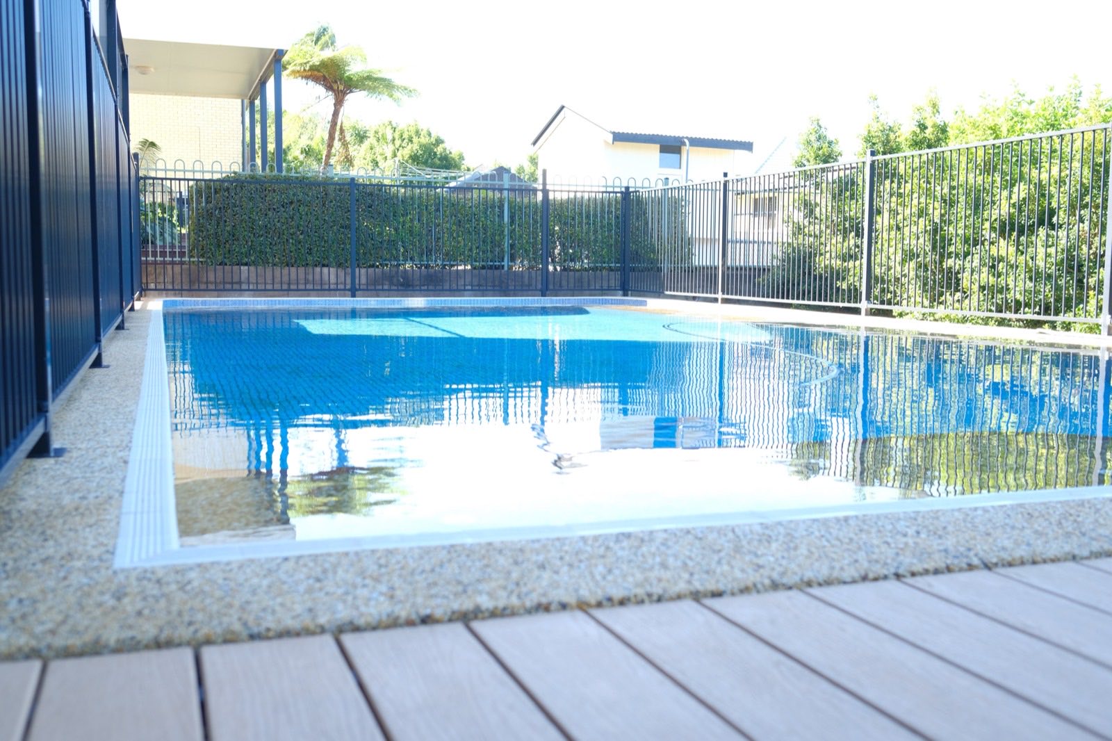 A fenced, compliant backyard pool in Brisbane